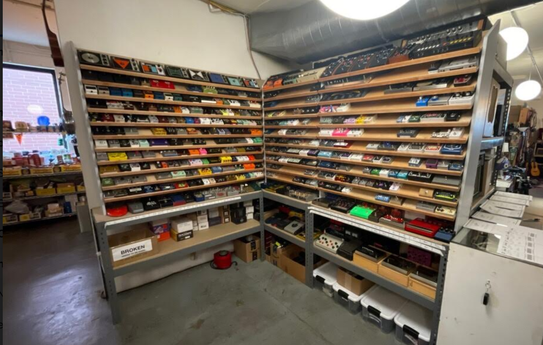 A photo of the finished shelf full of guitar pedals.